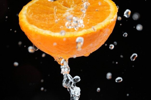 slice-of-orange-juicy-black-background-drop-of-water_3343364-6523492